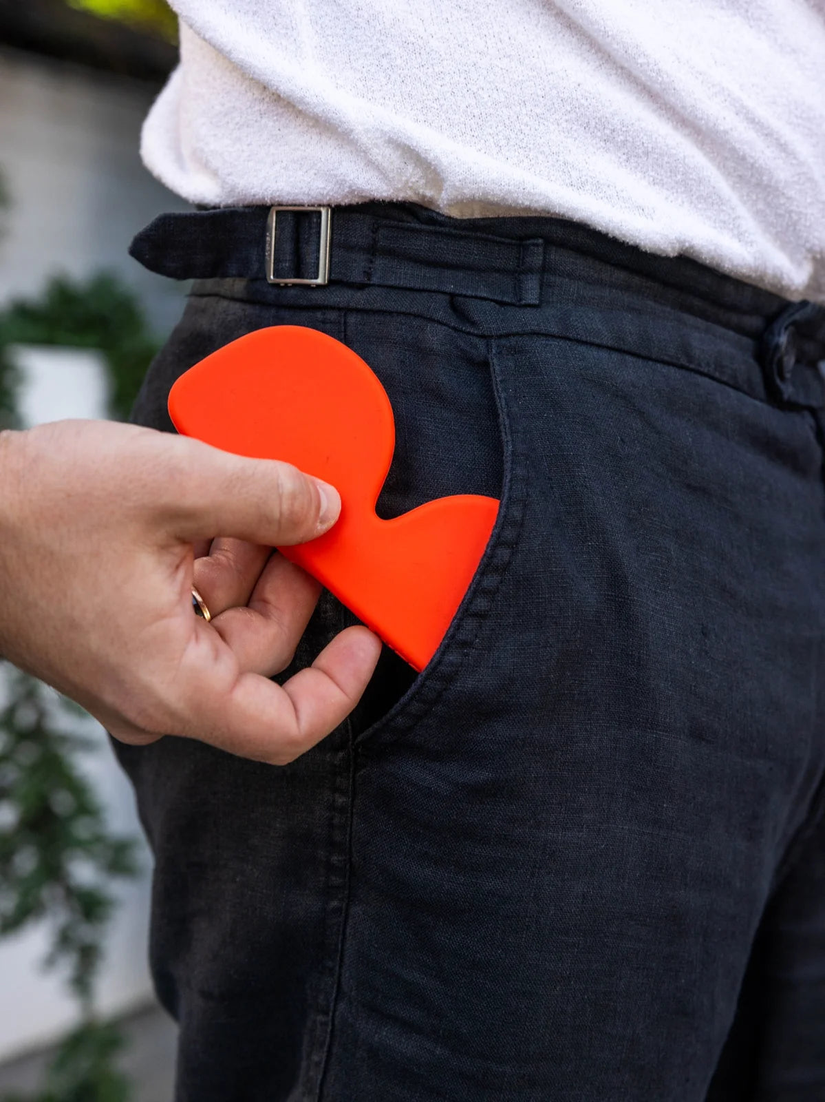 Orange Icons case tucked into a pocket